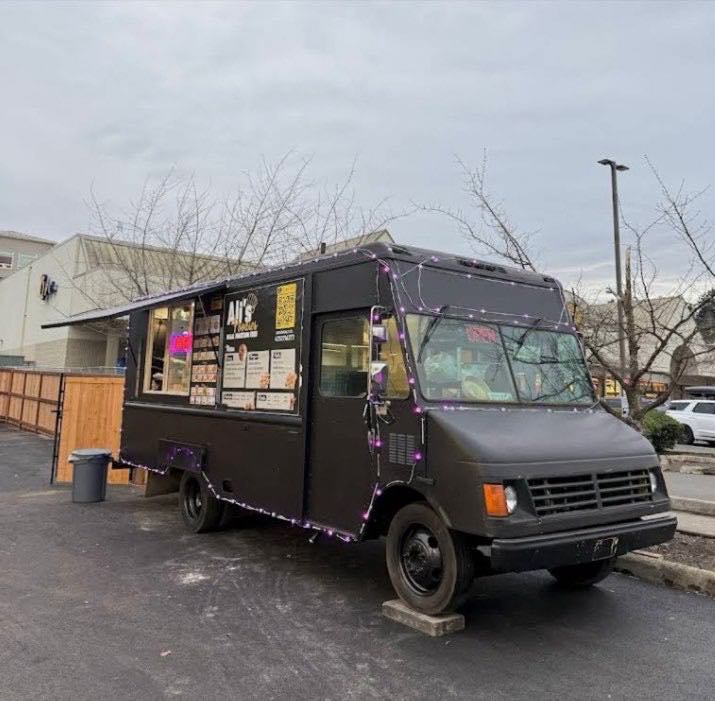 Ali's Foodies truck parked at the Shell station in daylight, serving hatch open